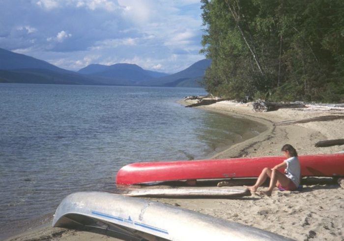 Two canoes on a white sand beach on Clearwater Lake. 